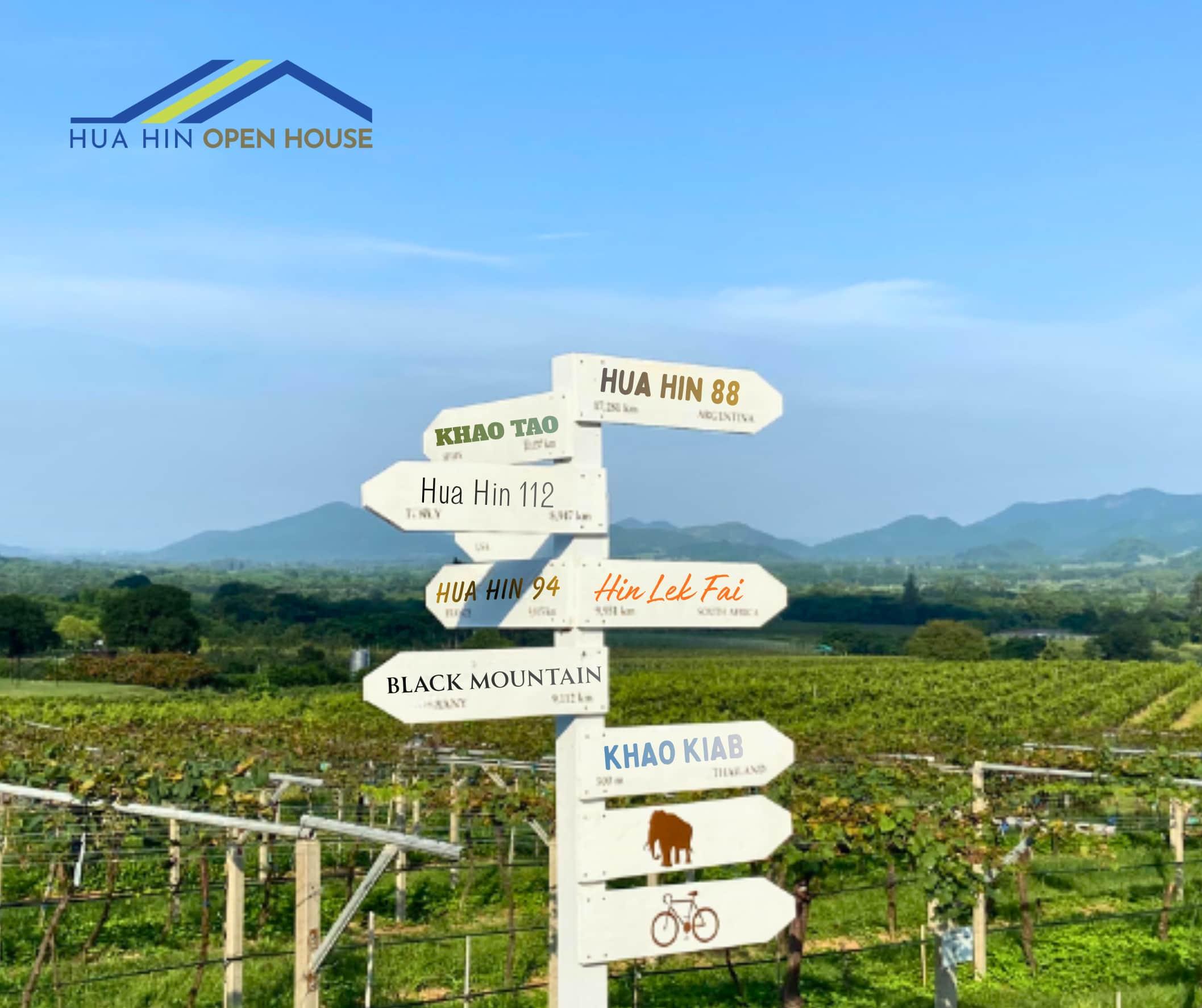 Signpost showing Hua Hin locations — Khao Tao, Hua Hin 88, Black Mountain, and more