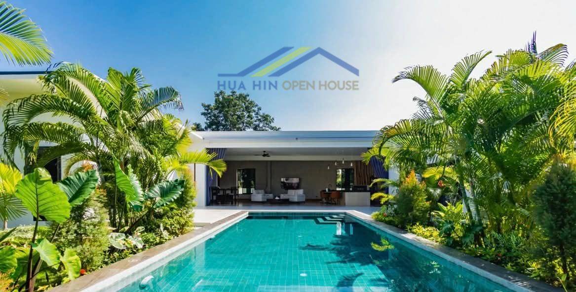 Modern 3-bedroom villa with a private pool, surrounded by lush tropical landscaping and minimalist design elements.