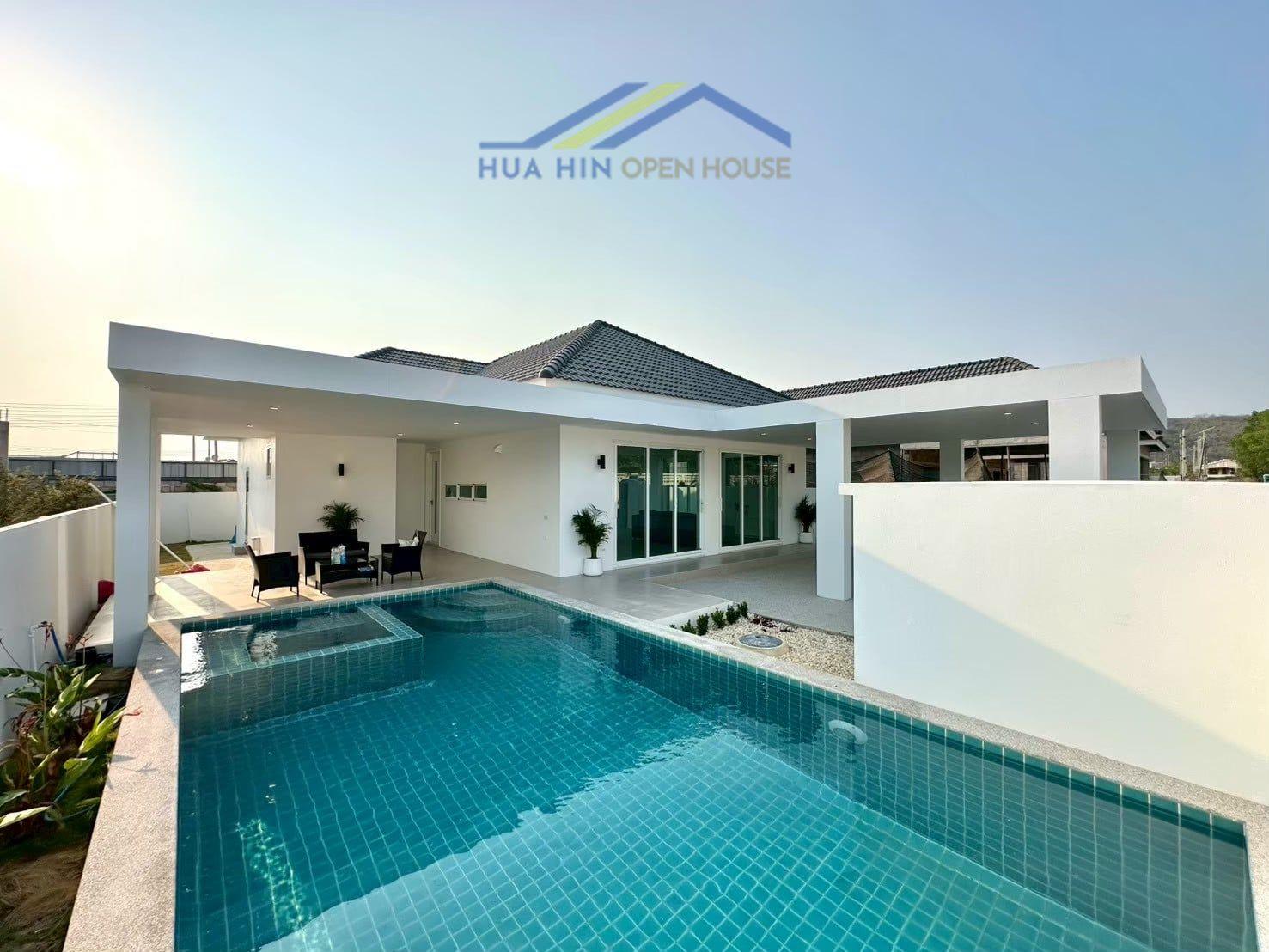 Modern pool villa featuring a private pool and jacuzzi, surrounded by lush greenery in a prime location near Black Mountain.