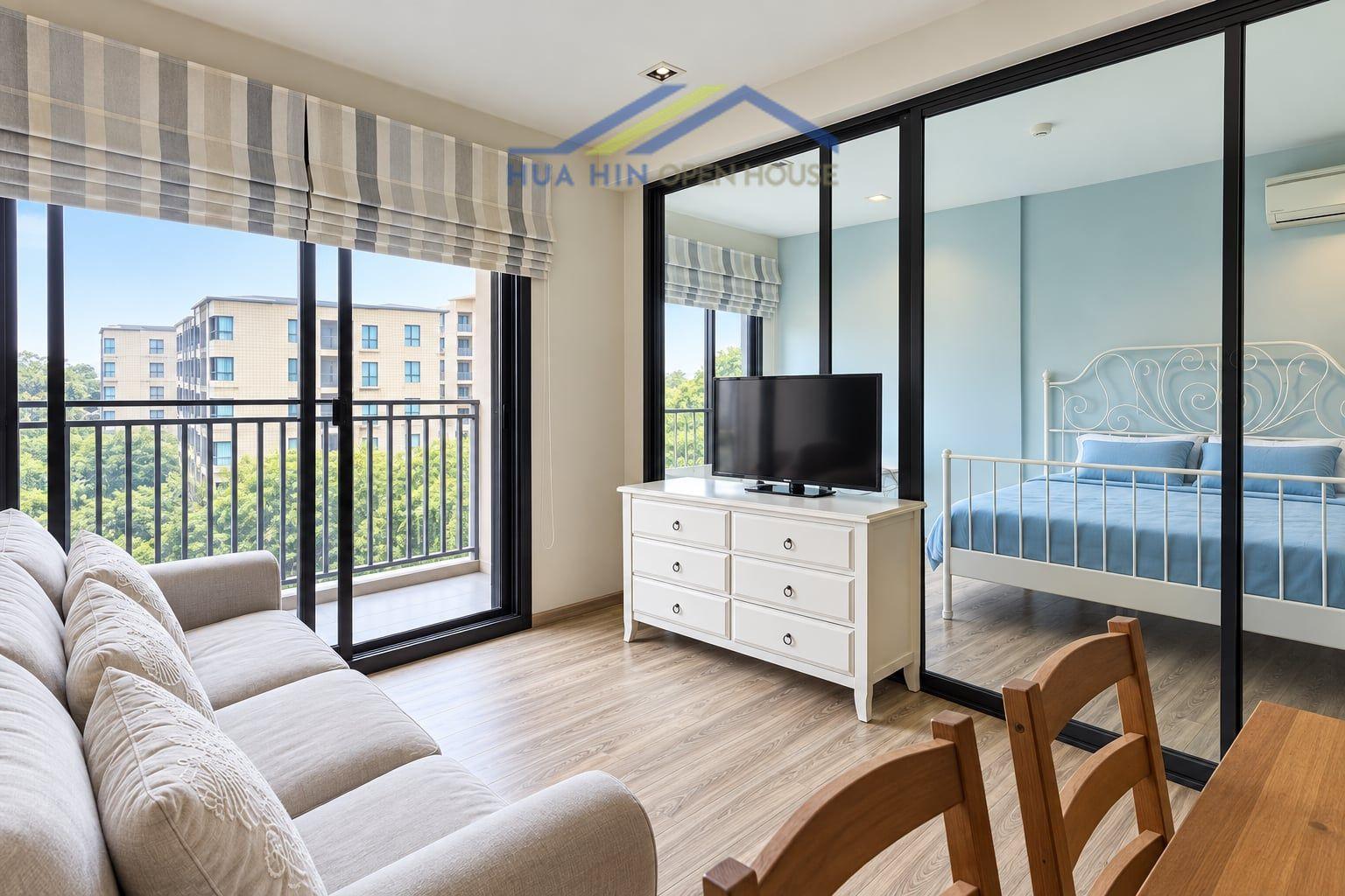 Bright and airy 1-bedroom condo with modern furnishings, balcony views, and a cozy living area.
