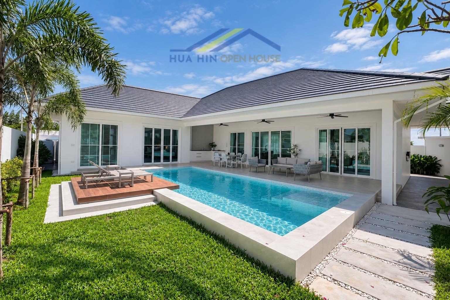Contemporary 3-bedroom villa featuring a private pool, outdoor seating, and lush greenery in Hua Hin.
