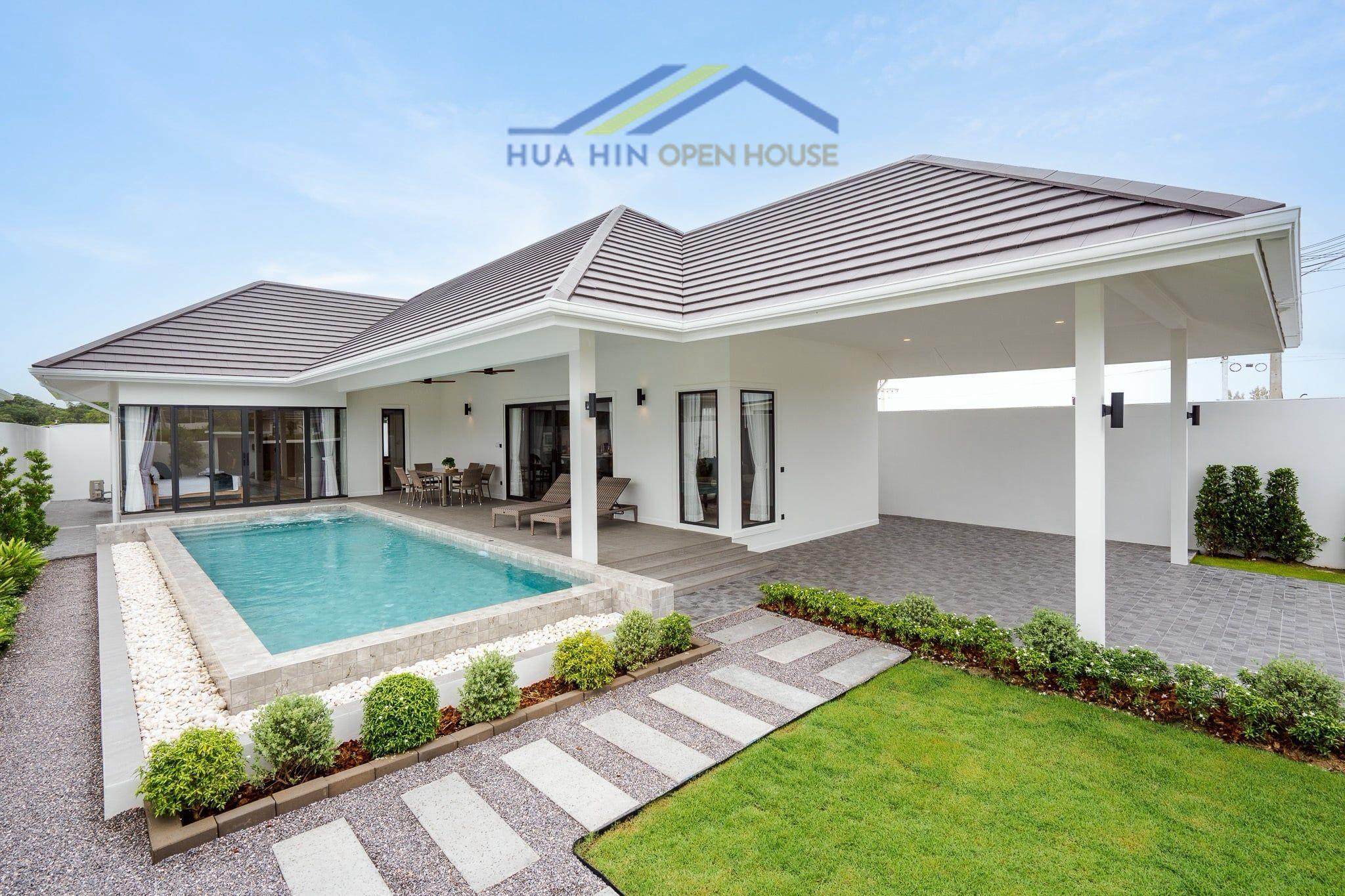 Green Village Hua Hin 3-bedroom villa with private pool, landscaped garden, and spacious outdoor seating area in Hua Hin.