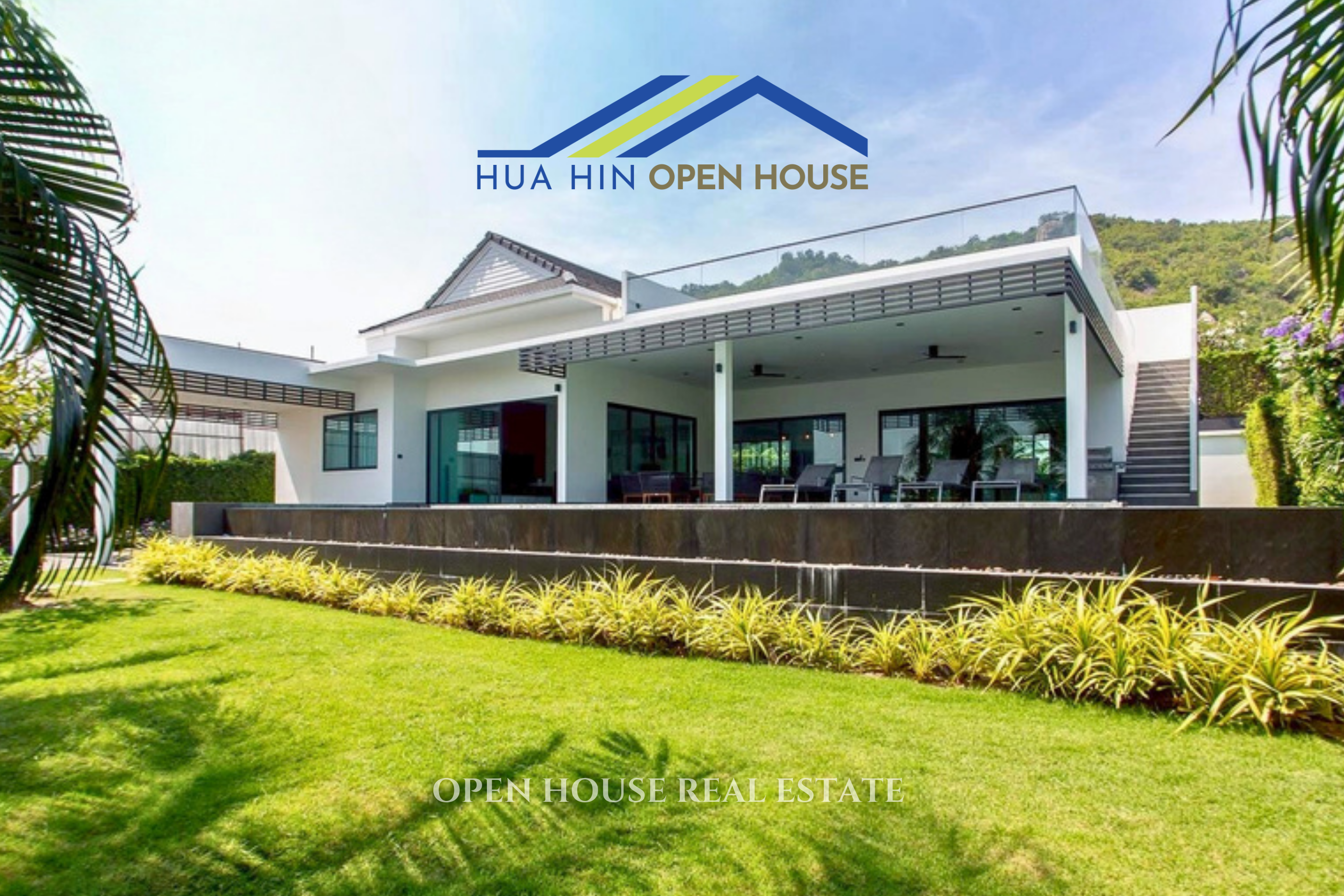 Modern 5-bedroom villa with a spacious lawn, poolside terrace, and mountain views in Hua Hin's Sivana HideAway.