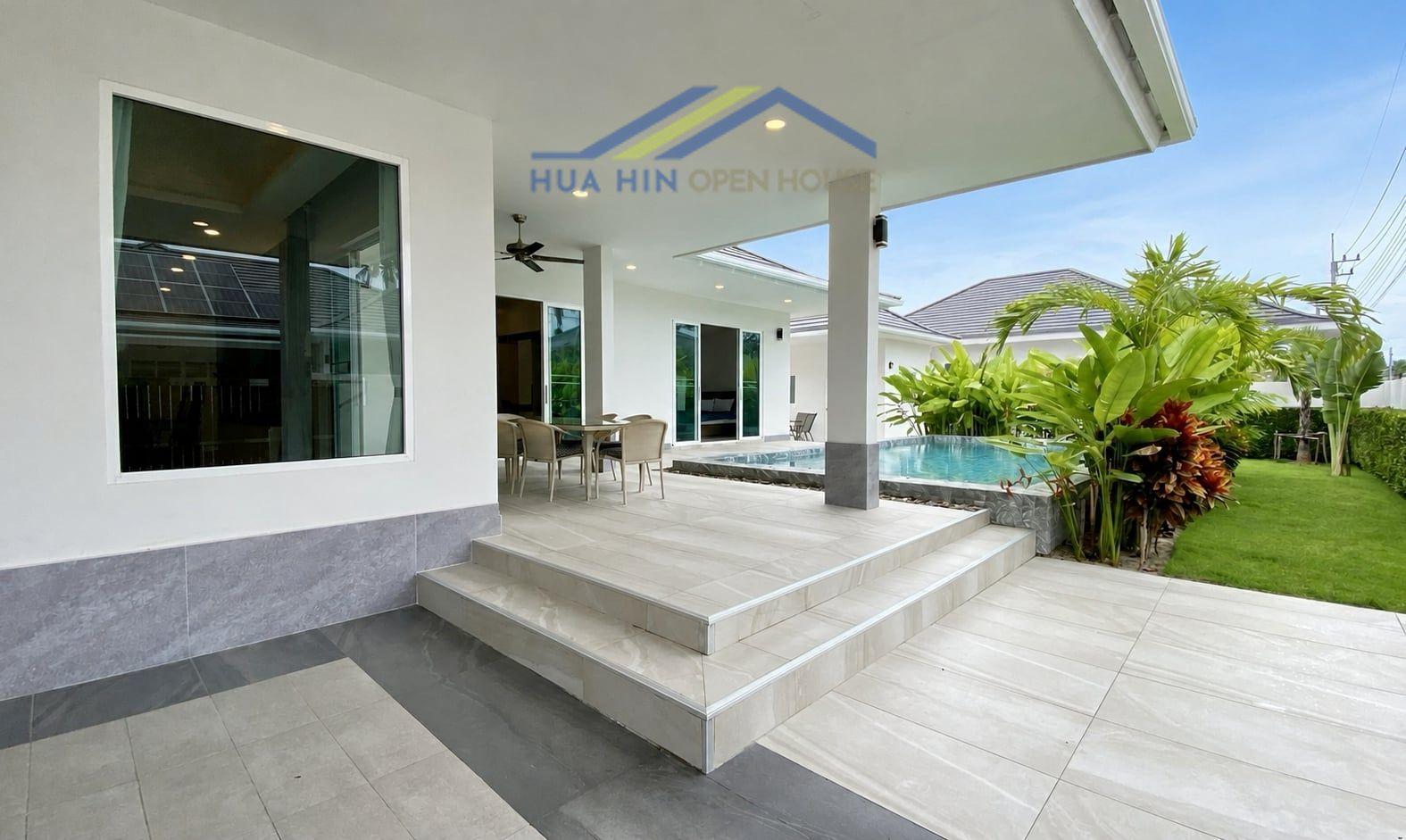 House for Rent 4-bedroom villa with a pool, outdoor dining area, and lush garden in Coco Hua Hin 88.
