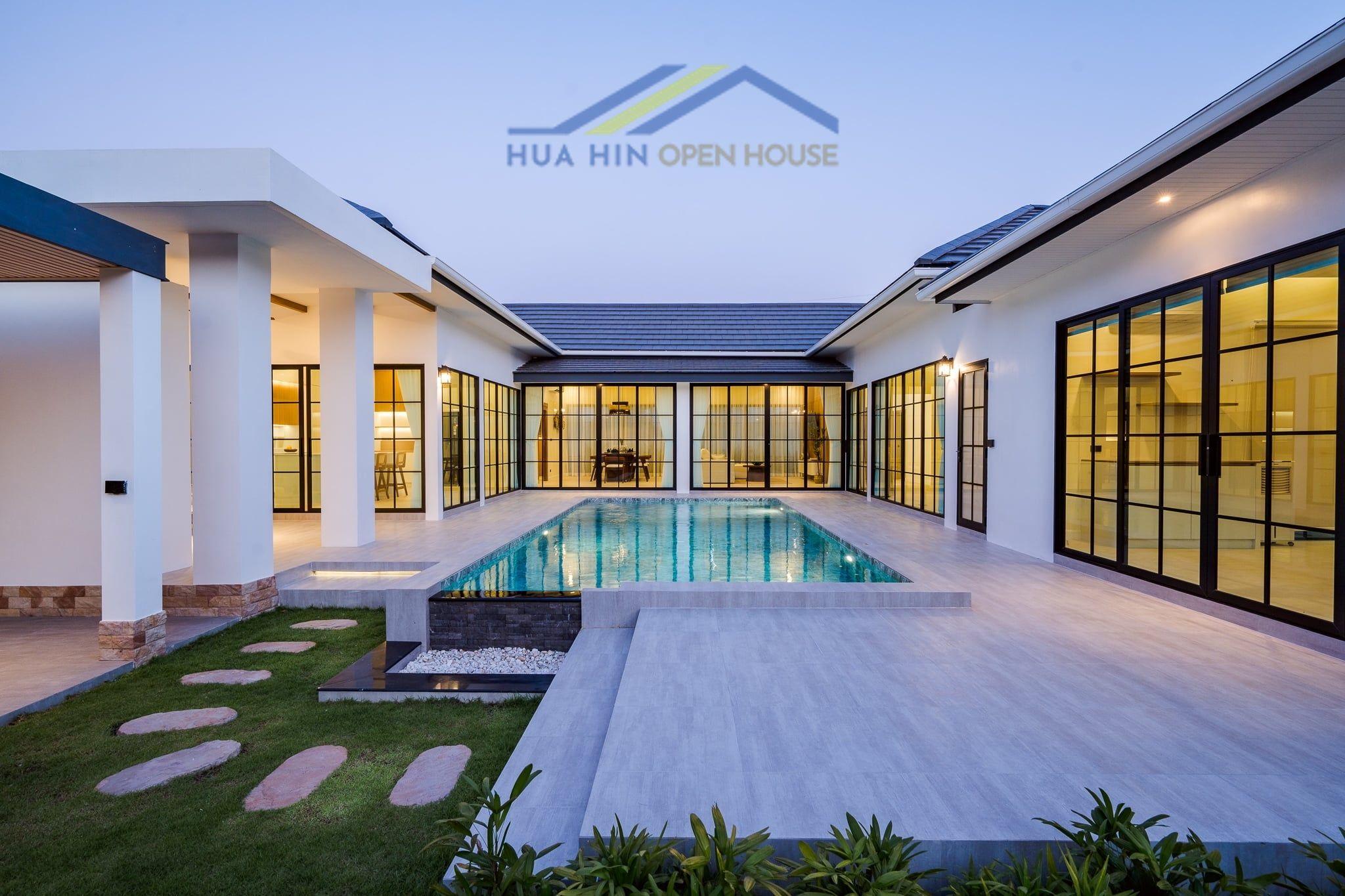 Modern courtyard villa featuring a private pool, surrounded by spacious living areas and landscaped gardens in Hua Hin.