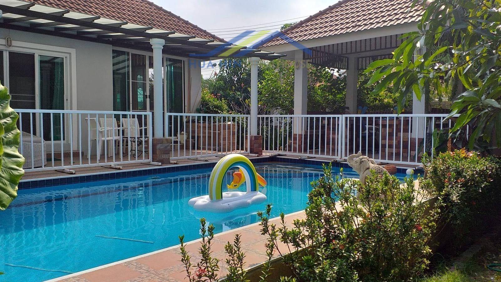 Spacious 3-bedroom villa with private pool, surrounded by lush greenery and a relaxing outdoor seating area.