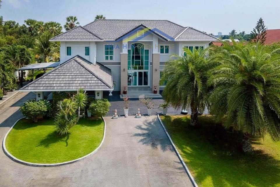 Estate for Sale in Cha-am with modern architecture, surrounded by lush greenery in Cha-am, Thailand.