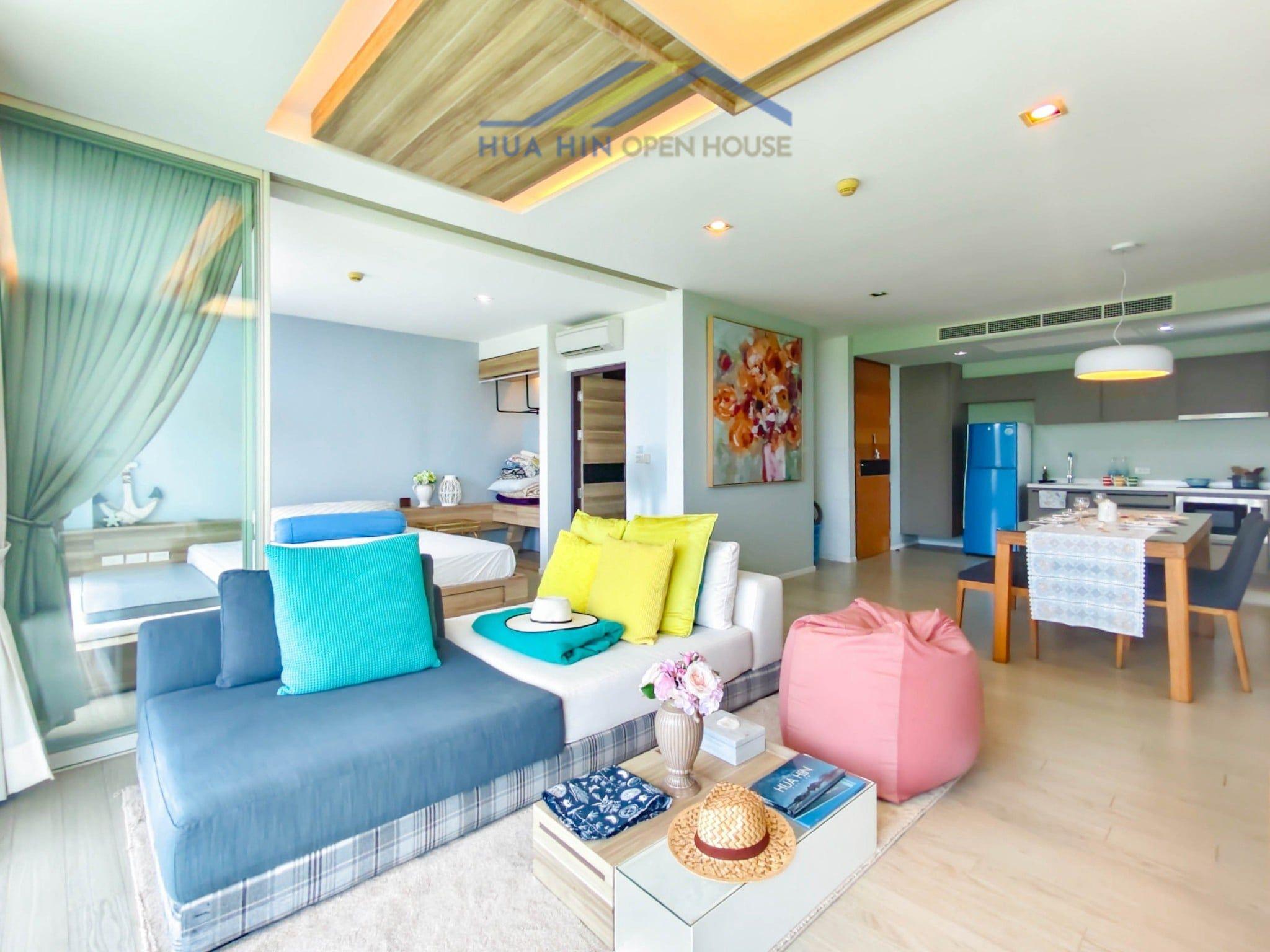 Condo for Sale at Wan Vayla Bright and modern 2-bedroom condo interior with colorful decor, cozy seating, and a dining area in Wan Vayla Hua Hin.