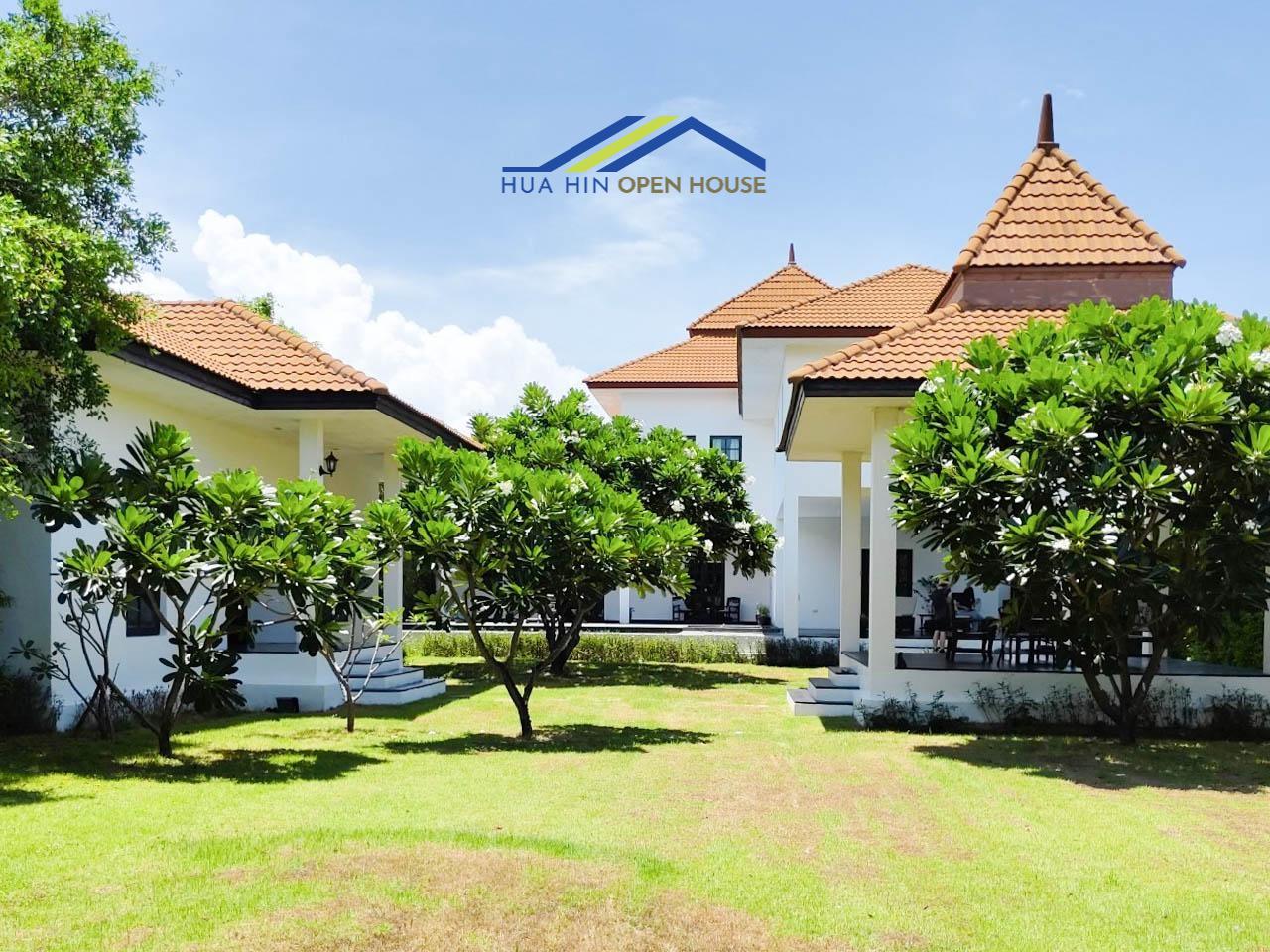 Spacious Balinese estate in Palm Hills, Hua Hin, featuring lush gardens and traditional architecture.