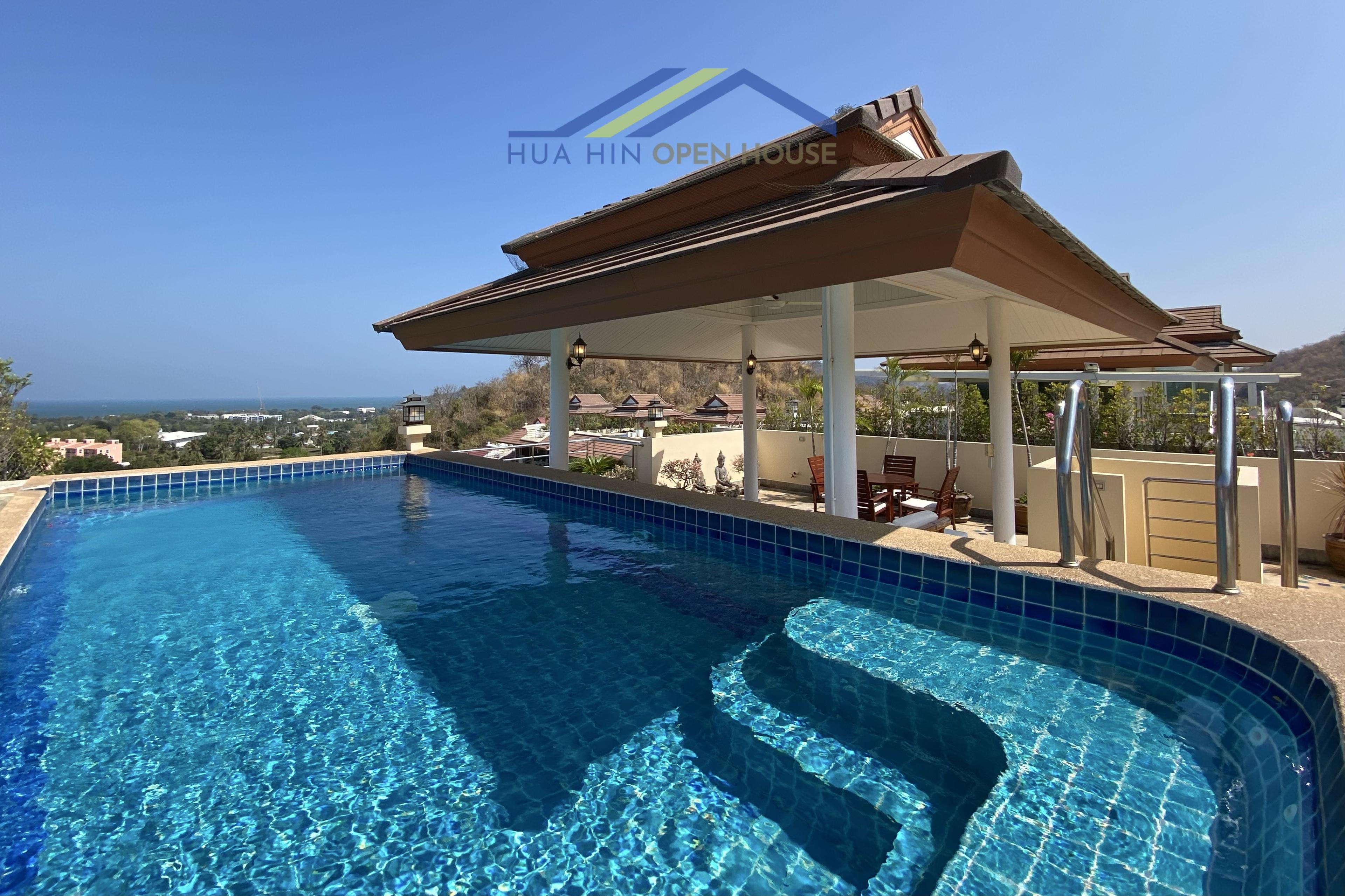 Stunning panoramic sea view from a private rooftop pool, featuring a spacious deck and lounge area in SeaRidge Hua Hin.