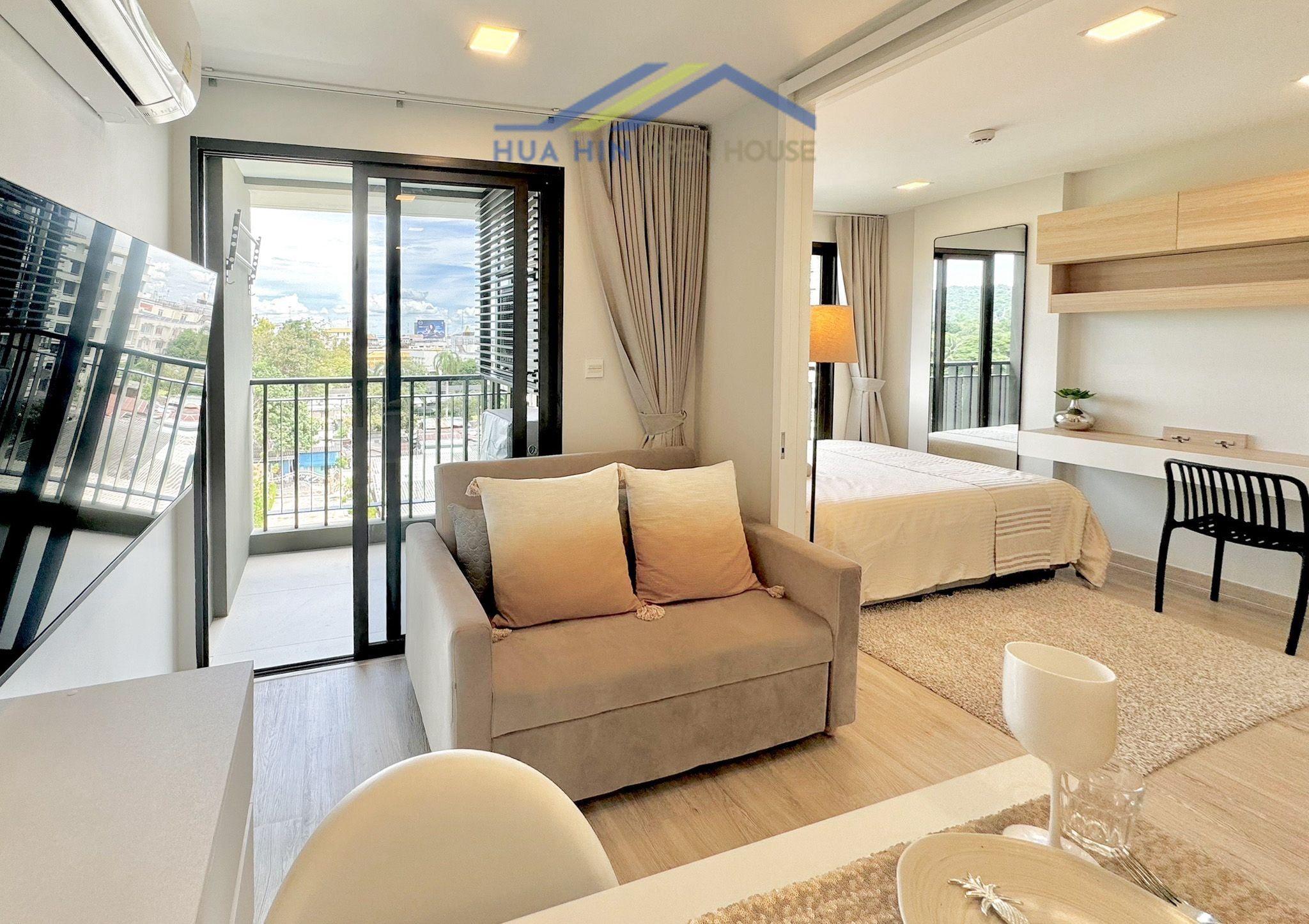 Bright 1-bedroom condo with pool view, modern furnishings, and balcony in Marvest Hua Hin's city center.