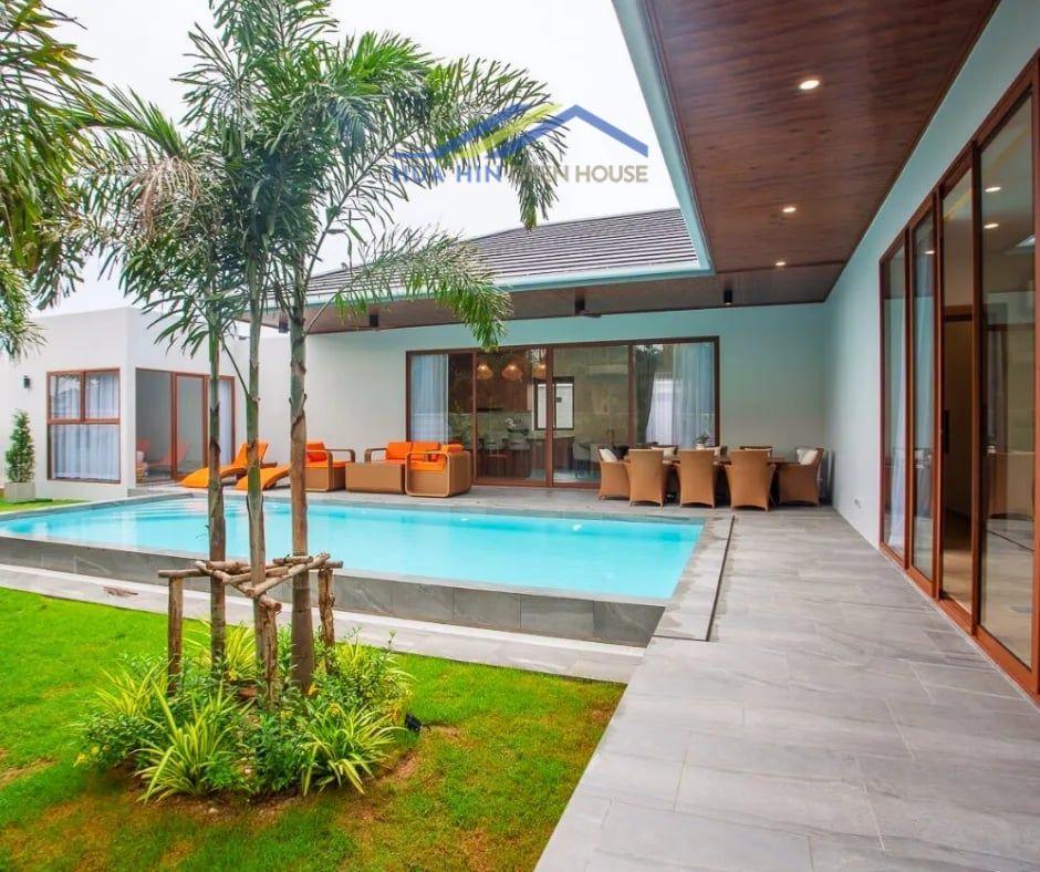Modern 4-bedroom villa featuring a private pool, lush garden, and spacious patio near Pineapple Golf Club, Hua Hin.